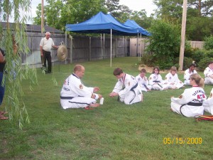 Black Belt Candlelight Ceremony - 2nd Degree Black Belt D. Cox lights his candle