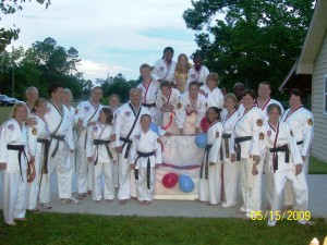 BlackBelt Candlelight Ceremony - Black Belts Celebrate Mr. Church Birthday - Wow notice all the demon red eyes - scary!
