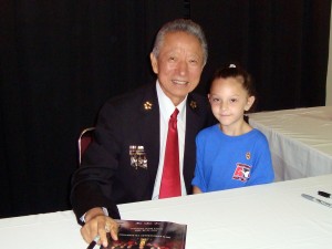 Grand Master and Ms. Sibley (age 6) Ms. Sibley (age 6) gets and autograph from Grand Master S. H. Lee